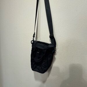 Black Crossbody Bag holds Stanley